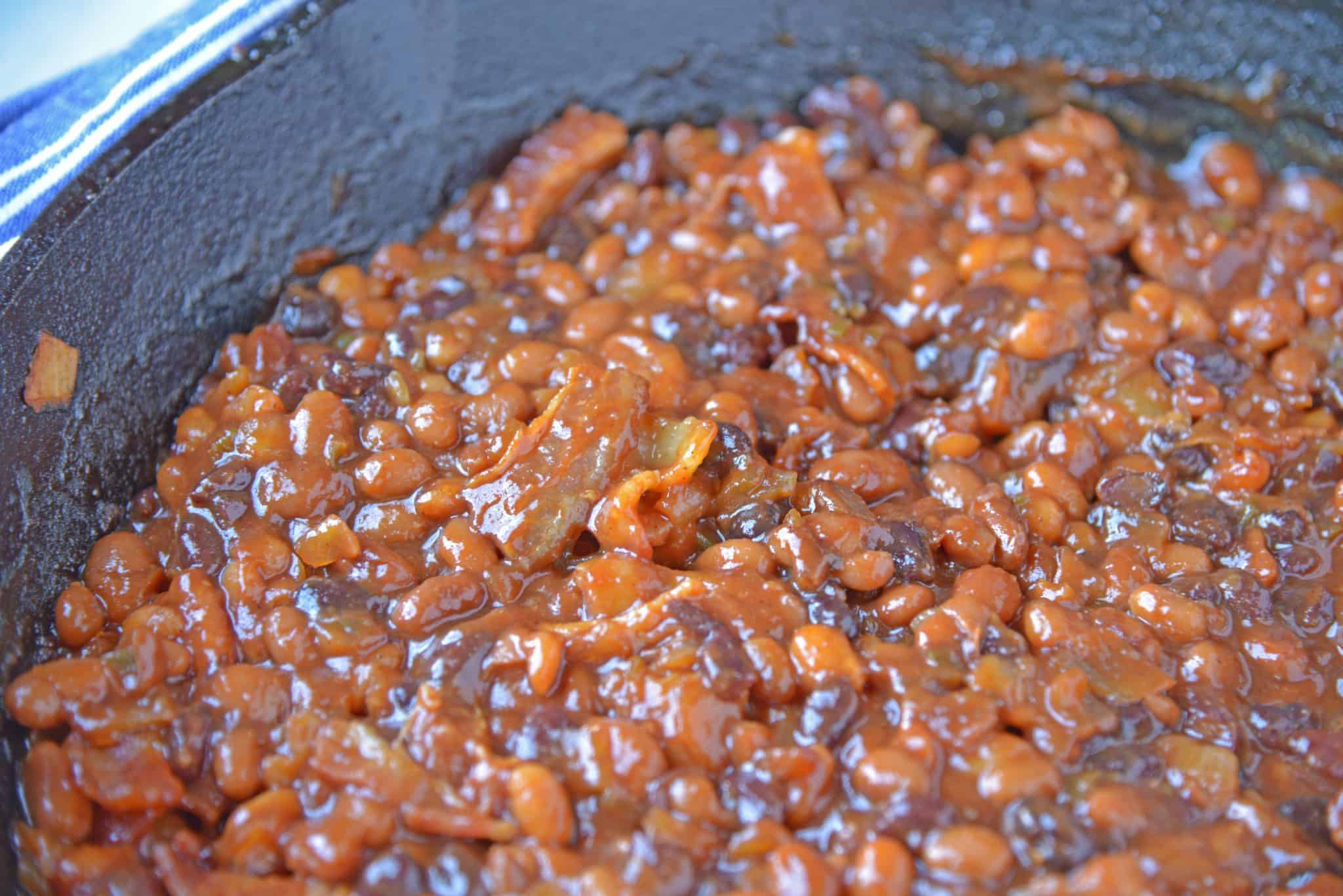 Cowboy Homemade Baked Beans are smoky, spicy and sweet. The perfect side dish recipe for BBQ, potlucks and parties. An easy baked bean recipe with loads of flavor! #homemadebakedbeans #bakedbeans www.savoryexperiments.com