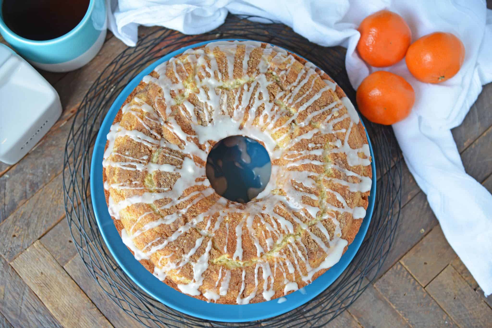 Sour Cream Coffee Cake is an easy coffee cake recipe with a streusel ribbon and crumb topping. Super moist without being overly sweet. Perfect for brunch or dessert. #sourcreamcoffeecake #easycoffeecakerecipe www.savoryexperiments.com 