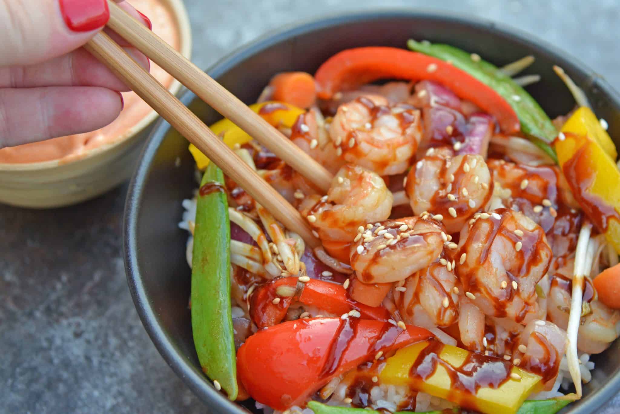 Skip the takeout and make this easy Teriyaki Shrimp Stir Fry instead! This Shrimp Stir Fry is an easy weeknight meal that the whole family will love! Best served with fried rice or noodles and packed full of veggies, this healthy recipe is sure to be a hit! #shrimpstirfry #teriyakirecipes #recipesthatuseteriyakisauce #teriyakishrimpstirfry #savoryexperiments