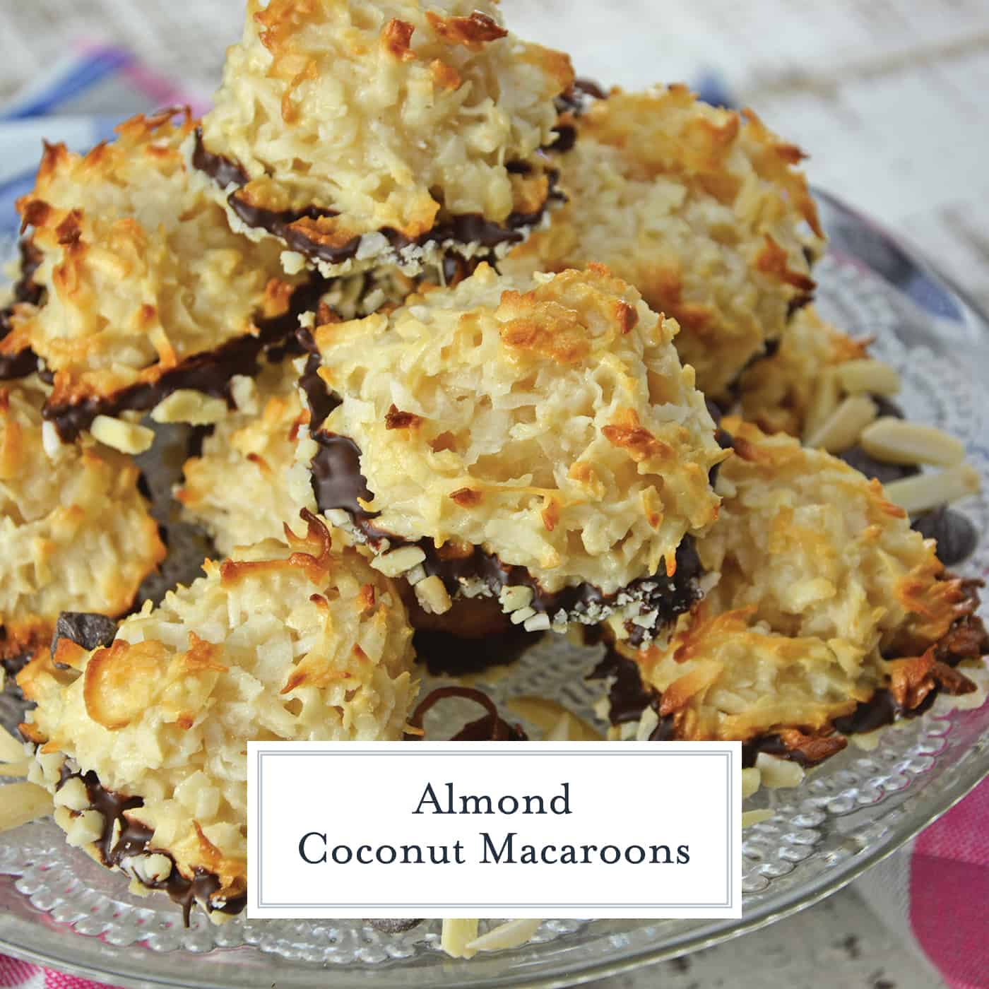 Almond Coconut Macaroons are light, fluffy coconut biscuits dipped in chocolate and almonds. Perfect as a dessert, for tea for as a an afternoon snack. #coconutmacaroons #macaroonsrecipe www.savoryexperiments.com 