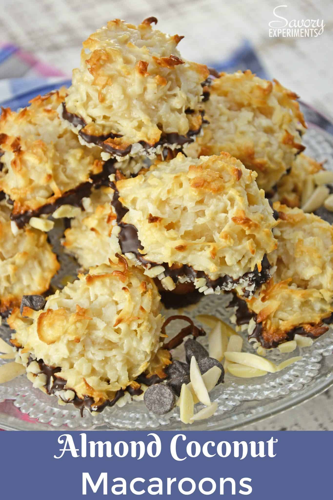 Almond Coconut Macaroons are light, fluffy coconut biscuits dipped in chocolate and almonds. Perfect as a dessert, for tea for as a an afternoon snack. #coconutmacaroons #macaroonsrecipe www.savoryexperiments.com