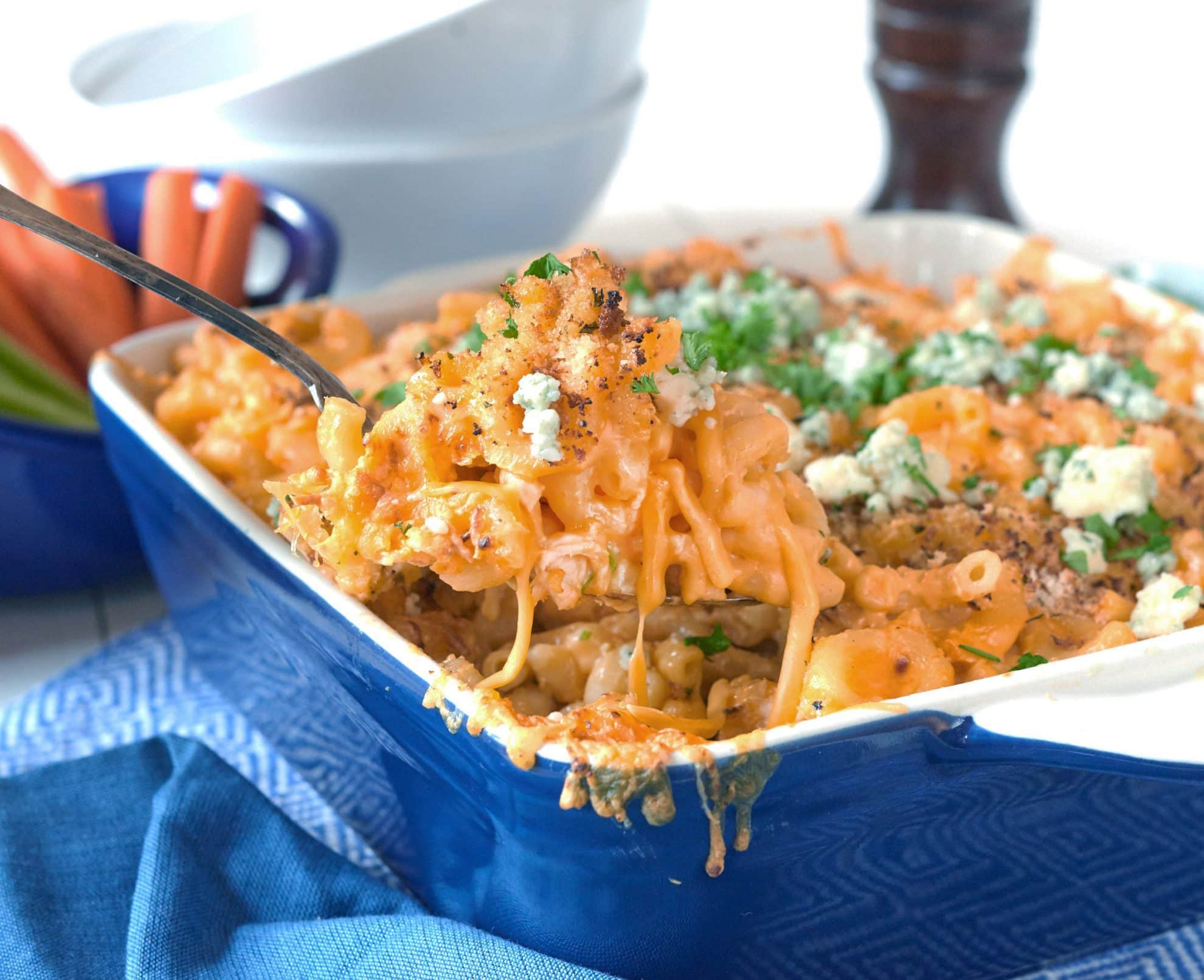 spoon with cheesy mac and cheese