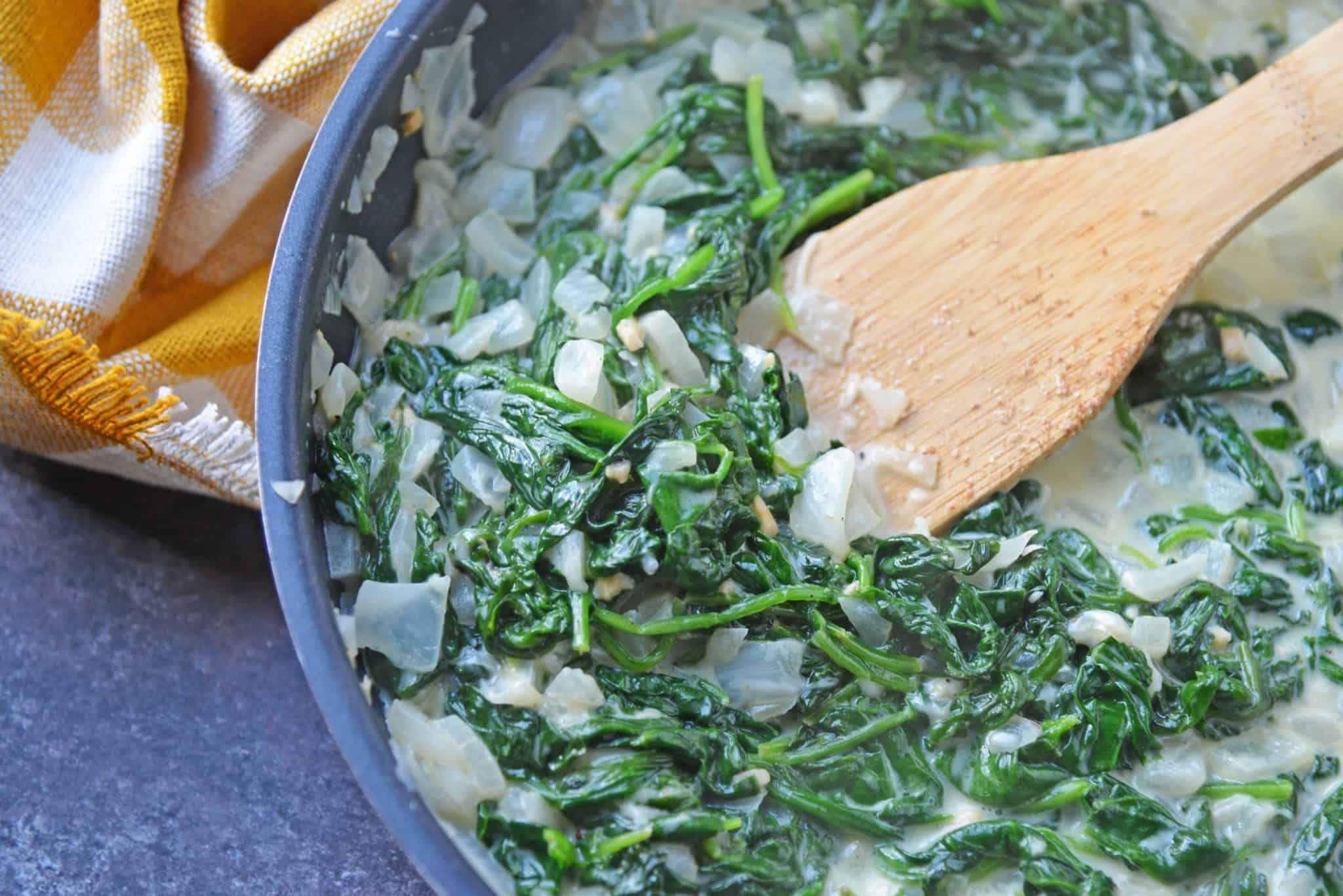 If you are wondering how to make creamed spinach, look no further! This easy creamed spinach recipe makes the perfect side dish to any meal. #creamedspinachrecipe #easycreamedspinach www.savoryexperiments.com