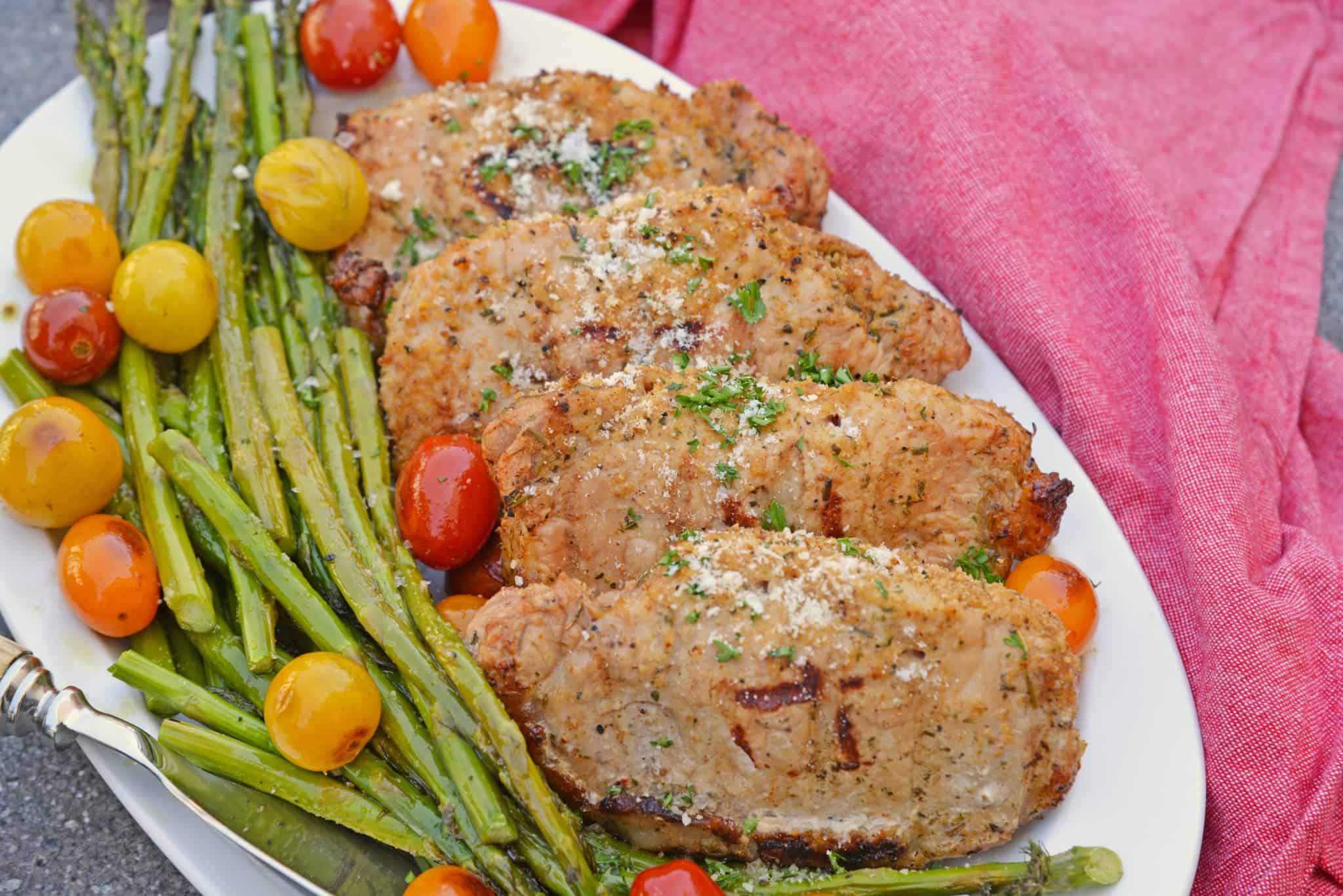 Grilled Stuffed Pork Chops are an easy grilled pork recipe. Herb marinated pork is stuffed with bread crumbs, herbs and Parmesan cheese and grilled to flavorful perfection in just 15 minutes! #grilledporkchops #stuffedporkchops www.savoryexperiments.com