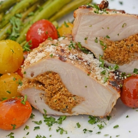 Grilled Stuffed Pork Chops are an easy grilled pork recipe. Herb marinated pork is stuffed with bread crumbs, herbs and Parmesan cheese and grilled to flavorful perfection in just 15 minutes! #grilledporkchops #stuffedporkchops www.savoryexperiments.com