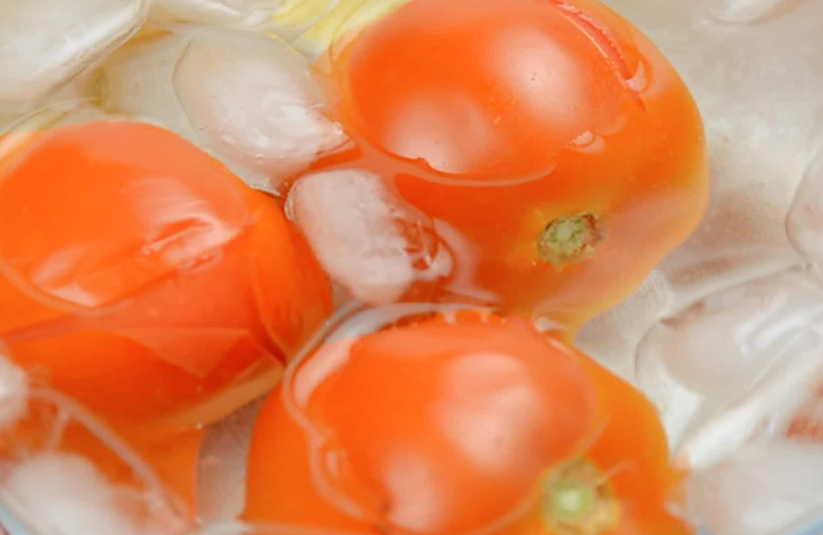 Learn how to peel a tomato in just a minute! Super easy without cooking the tomato. Perfect for sauces, salads and salsas! #howtopeelatomato #tomatoes www.savoryexperiments.com 