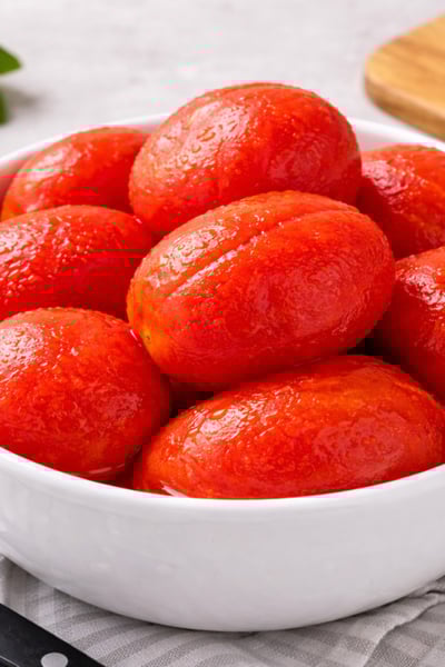 bowl of peeled roma tomatoes
