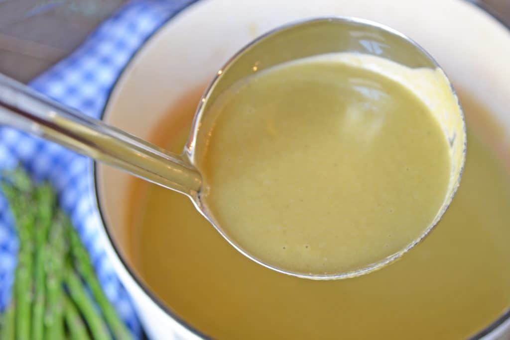 Asparagus lovers will love this creamy asparagus soup! Deliciously smooth and flavored to perfection, this cream of asparagus soup makes the perfect appetizer! #asparagussoup #creamofasparagussoup #creamyasparagussoup www.savoryexperiments.com