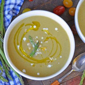 Asparagus lovers will love this creamy asparagus soup! Deliciously smooth and flavored to perfection, this cream of asparagus soup makes the perfect appetizer! #asparagussoup #creamofasparagussoup #creamyasparagussoup www.savoryexperiments.com