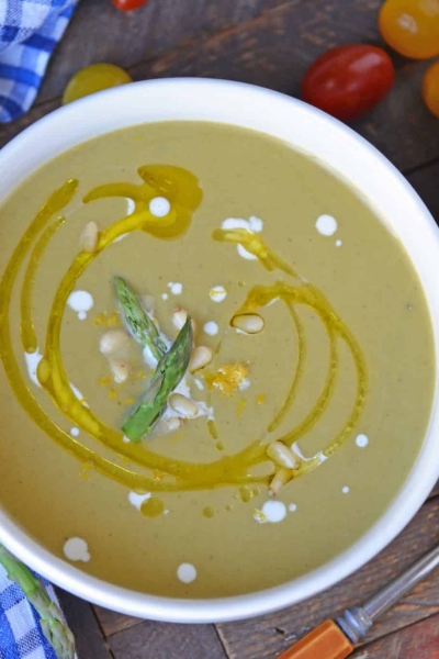 Asparagus lovers will love this creamy asparagus soup! Deliciously smooth and flavored to perfection, this cream of asparagus soup makes the perfect appetizer! #asparagussoup #creamofasparagussoup #creamyasparagussoup www.savoryexperiments.com