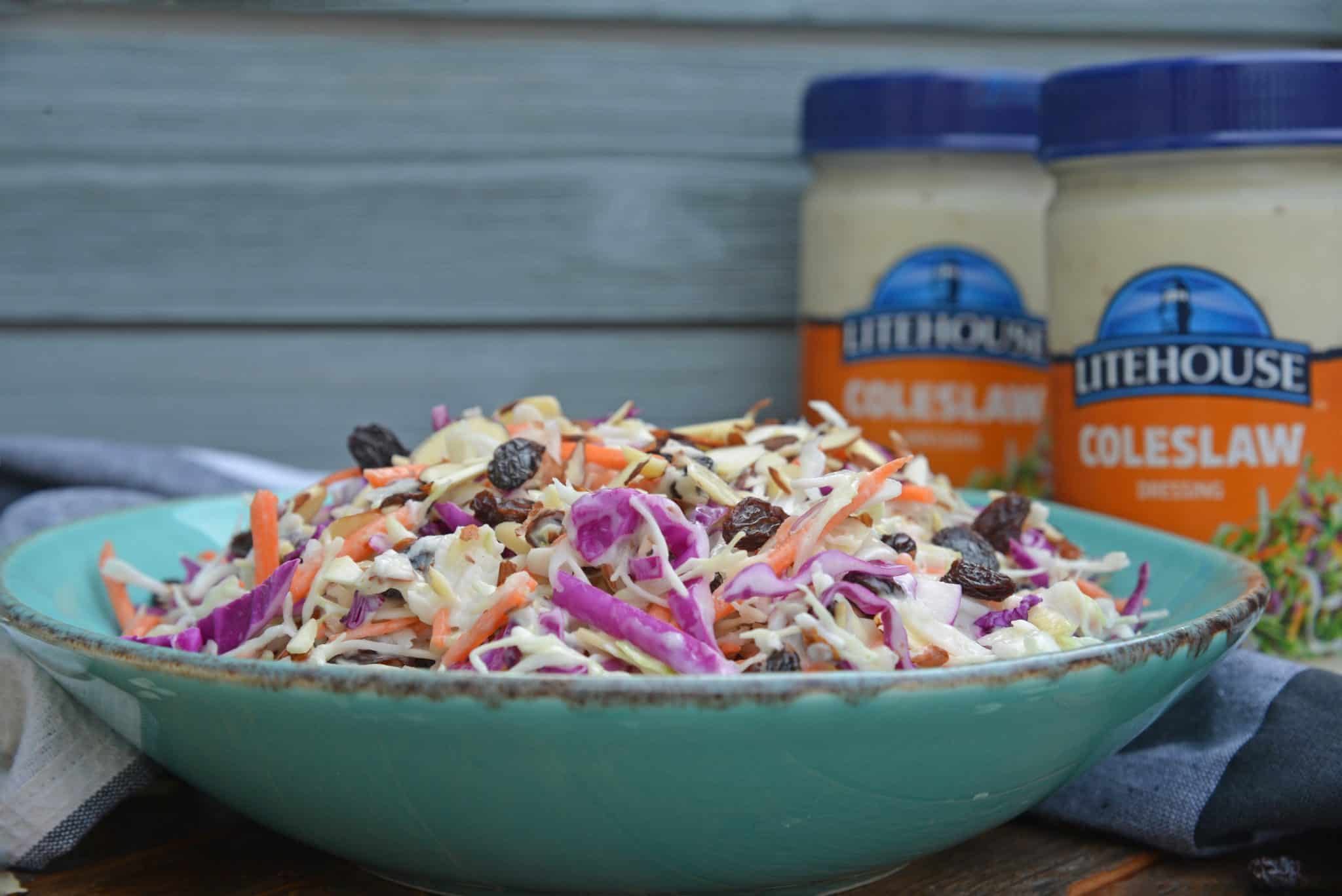 Creamy Coleslaw with almonds and raisins is an easy coleslaw recipe that is mix and serve. Coleslaw dressing, almonds, raisins and crisp cabbage mix are the perfect BBQ dish. #creamycoleslaw @coleslawrecipe www.savoryexperiments.com