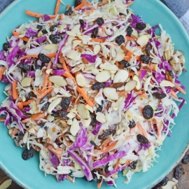 Creamy Coleslaw with almonds and raisins is an easy coleslaw recipe that is mix and serve. Coleslaw dressing, almonds, raisins and crisp cabbage mix are the perfect BBQ dish. #creamycoleslaw @coleslawrecipe www.savoryexperiments.com