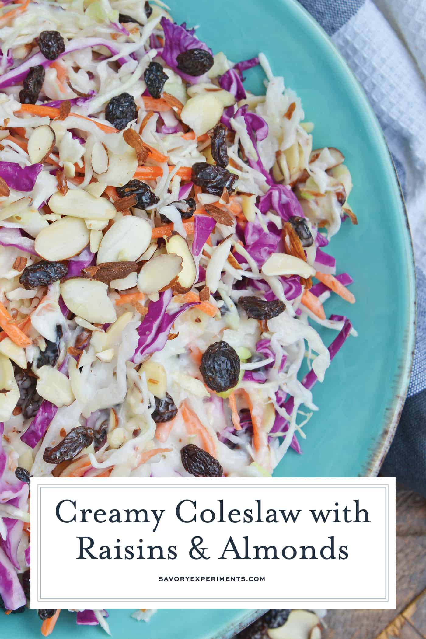 Creamy Coleslaw with almonds and raisins is an easy coleslaw recipe that is mix and serve. Coleslaw dressing, almonds, raisins and crisp cabbage mix are the perfect BBQ dish. #creamycoleslaw #coleslawrecipe www.savoryexperiments.com