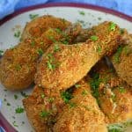 Crispy Baked Chicken is a melt-in-your-mouth oven fried chicken with tongue-tingling flavor that will leave you craving more. #crispybakedchicken #ovenbakedchicken #bestovenfriedchicken www.savoryexperiments.com