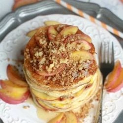 Peach cobbler pancakes on a white plate