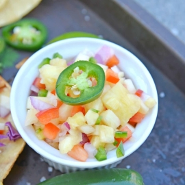 Looking for an easy homemade salsa recipe? With pineapple, jalapenos, peppers and lime juice, you can't go wrong with this Pineapple Salsa recipe! #pineapplesalsa #pineapplesalsarecipe #homemadesalsarecipe www.savoryexperiments.com