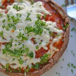 This Quick Portabella Pizza is the ultimate low carb pizza and easiest stuffed portabella recipe with only 4 ingredients and ready in 20 minutes! #portabellamushroomrecipes #stuffedportabellamushrooms #portabellapizza #lowcarbpizza www.savoryexperiments.com