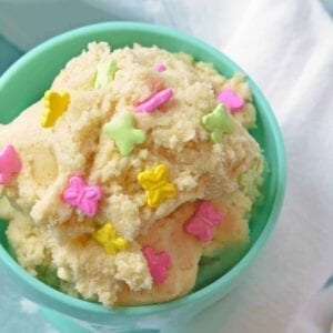 Close up of sugar cookie dough in a teal bowl