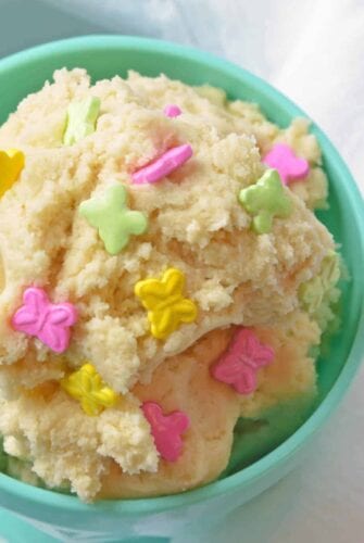 Close up of sugar cookie dough in a teal bowl