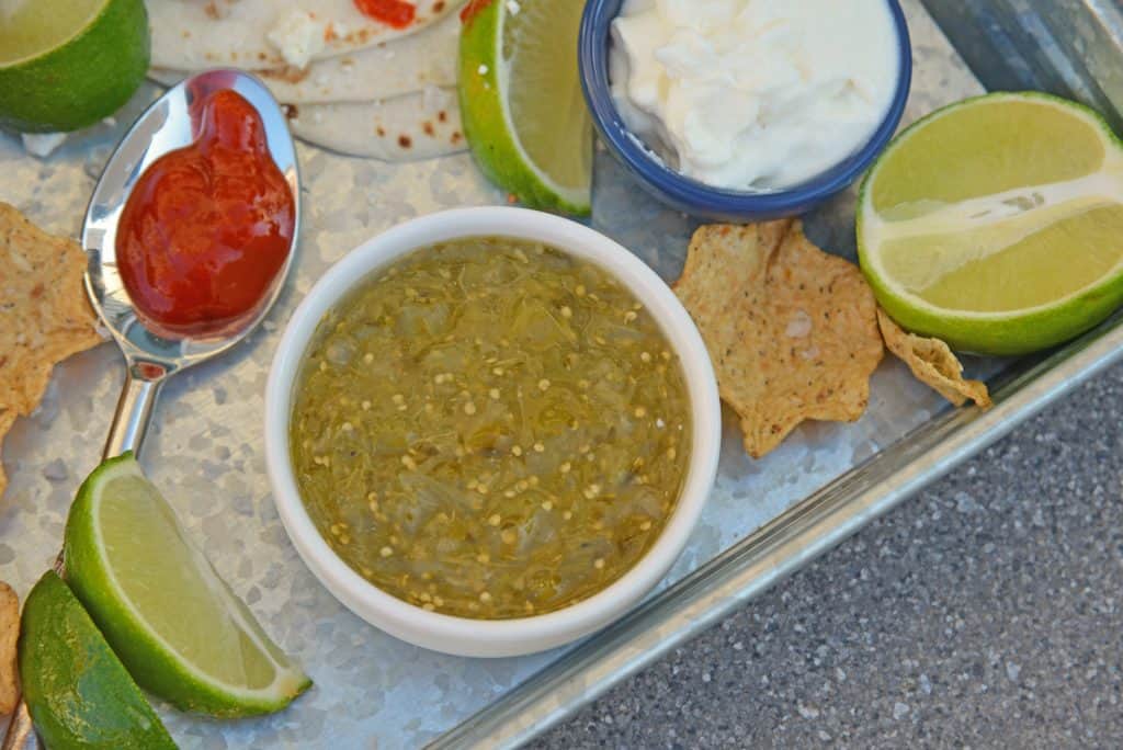 Tomatillo salsa is an easy, versatile homemade salsa that can be added to your favorite Mexican recipes or served as an appetizer with chips. #tomatillosalsa #salsaverde #greensalsa www.savoryexperiments.com