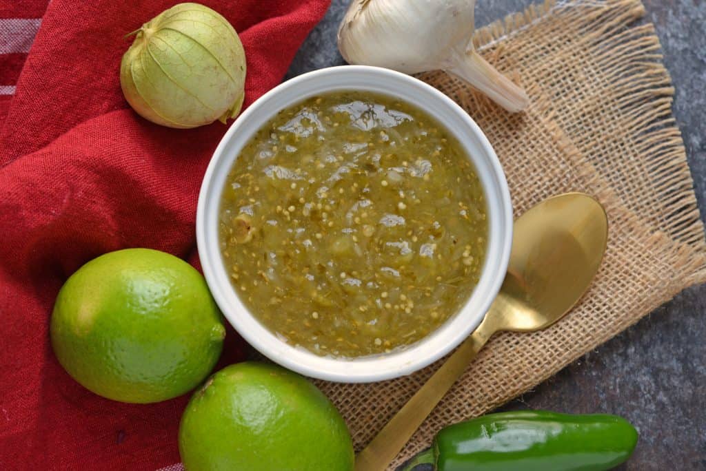 Tomatillo salsa is an easy, versatile homemade salsa that can be added to your favorite Mexican recipes or served as an appetizer with chips. #tomatillosalsa #salsaverde #greensalsa www.savoryexperiments.com