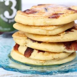 Pancakes with bacon on a blue plate