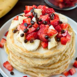 Banana split pancakes with bananas and strawberries