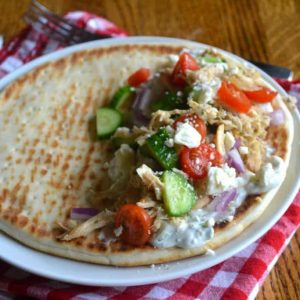 Chicken gyros on a red and white napkin