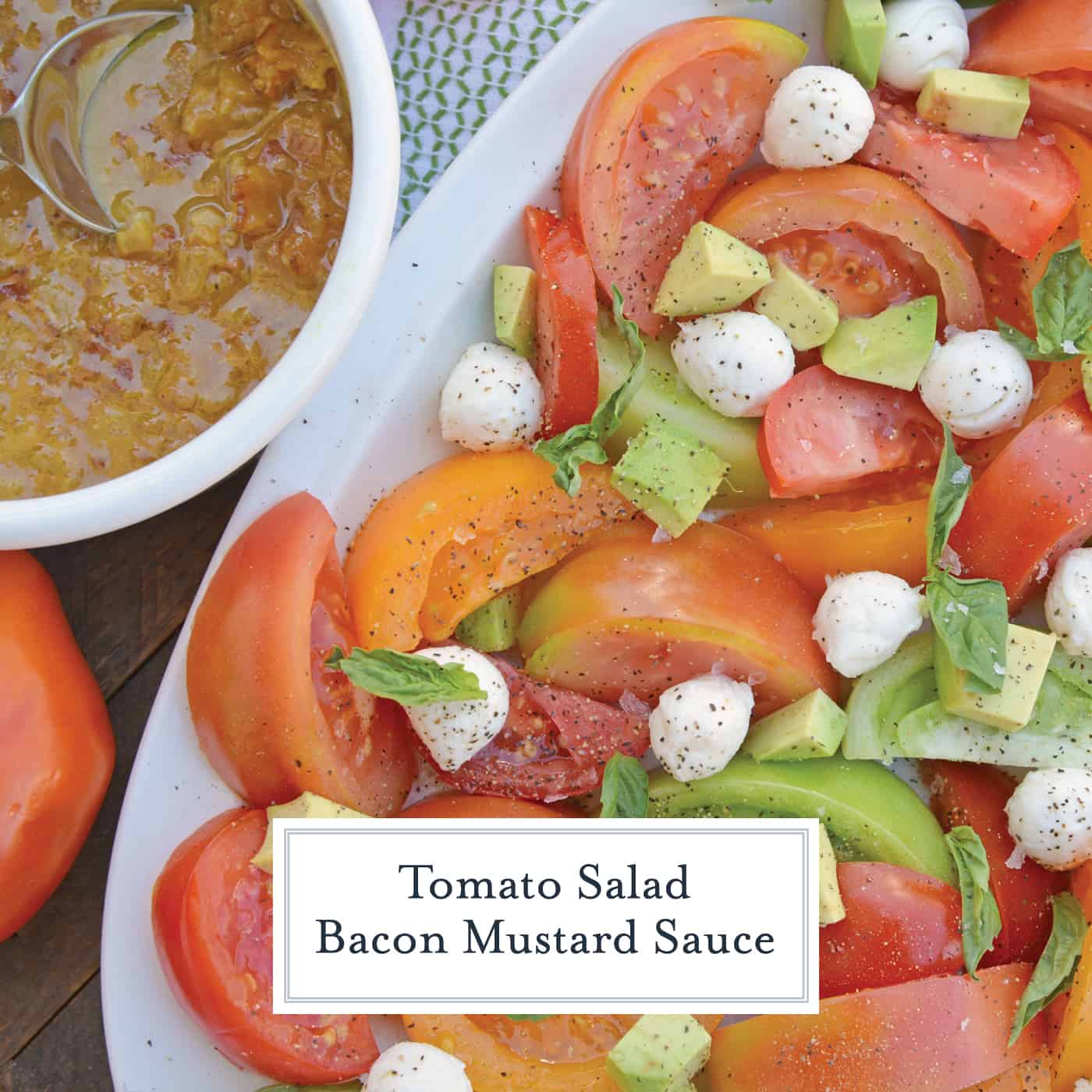 Tomato Salad with Mustard Bacon Dressing is the ultimate summer side dish using lush tomatoes, avocado mozzarella & basil. Make it ahead for any party or BBQ. #tomatosalad #tomatorecipes www.savoryexperiments.com 