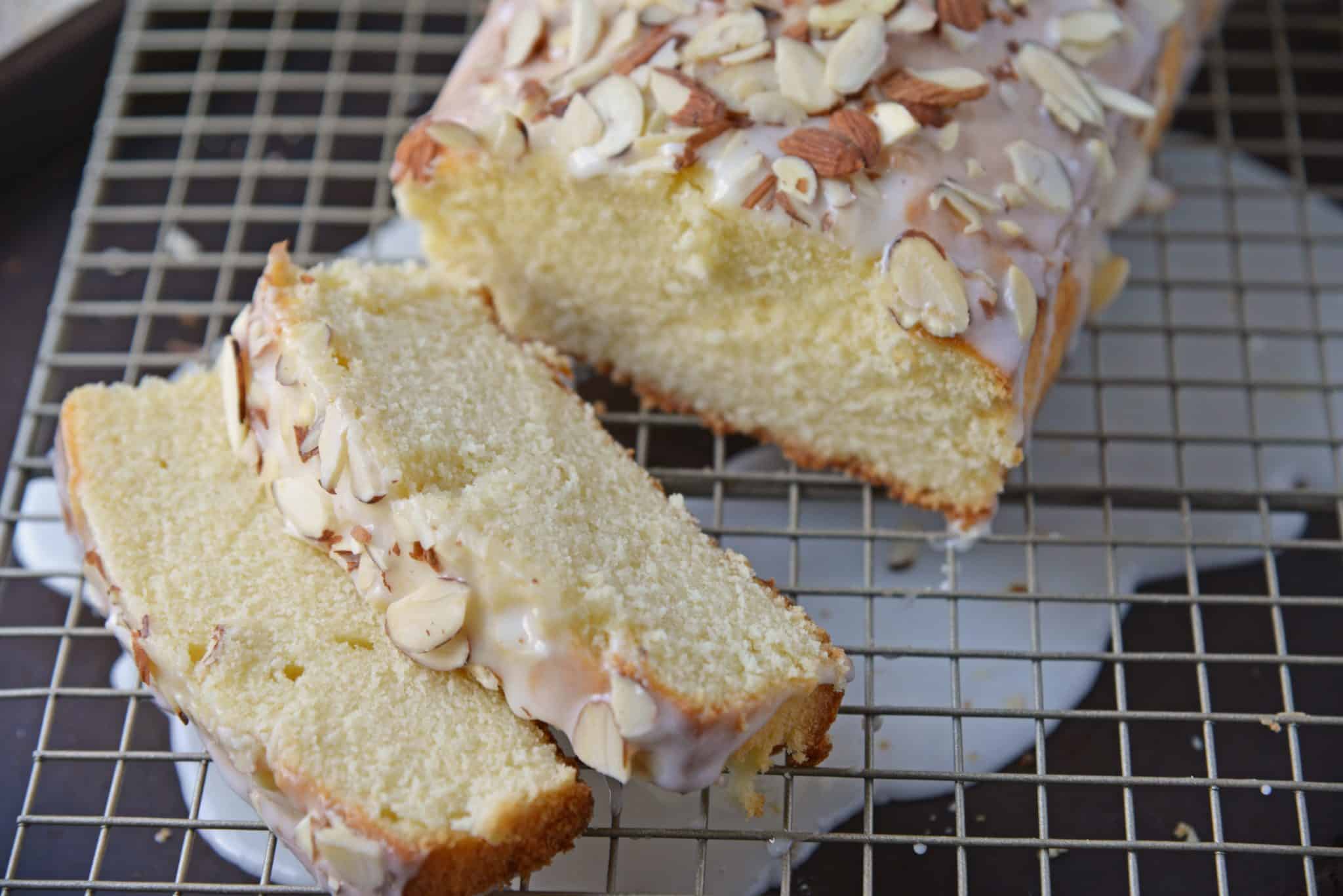 This Almond Pound Cake recipe is easy, moist and as dense as a pound cake should be. Topped with an almond pound cake glaze, it's the perfect dessert! #almondpoundcake #poundcakerecipe www.savoryexperiments.com