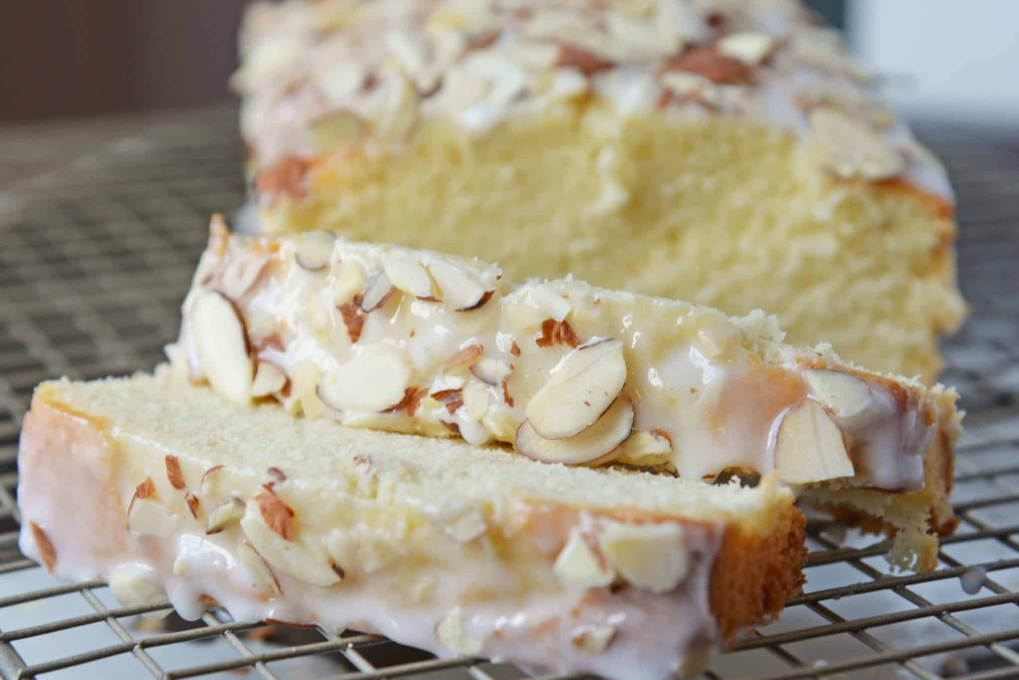 This Almond Pound Cake recipe is easy, moist and as dense as a pound cake should be. Topped with an almond pound cake glaze, it's the perfect dessert! #almondpoundcake #poundcakerecipe www.savoryexperiments.com