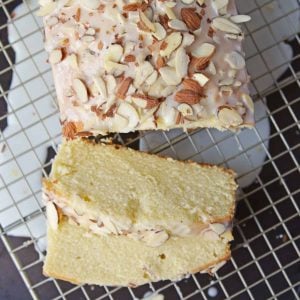 This Almond Pound Cake recipe is easy, moist and as dense as a pound cake should be. Topped with an almond pound cake glaze, it's the perfect dessert! #almondpoundcake #poundcakerecipe www.savoryexperiments.com