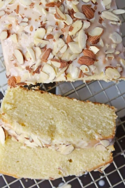 This Almond Pound Cake recipe is easy, moist and as dense as a pound cake should be. Topped with an almond pound cake glaze, it's the perfect dessert! #almondpoundcake #poundcakerecipe www.savoryexperiments.com