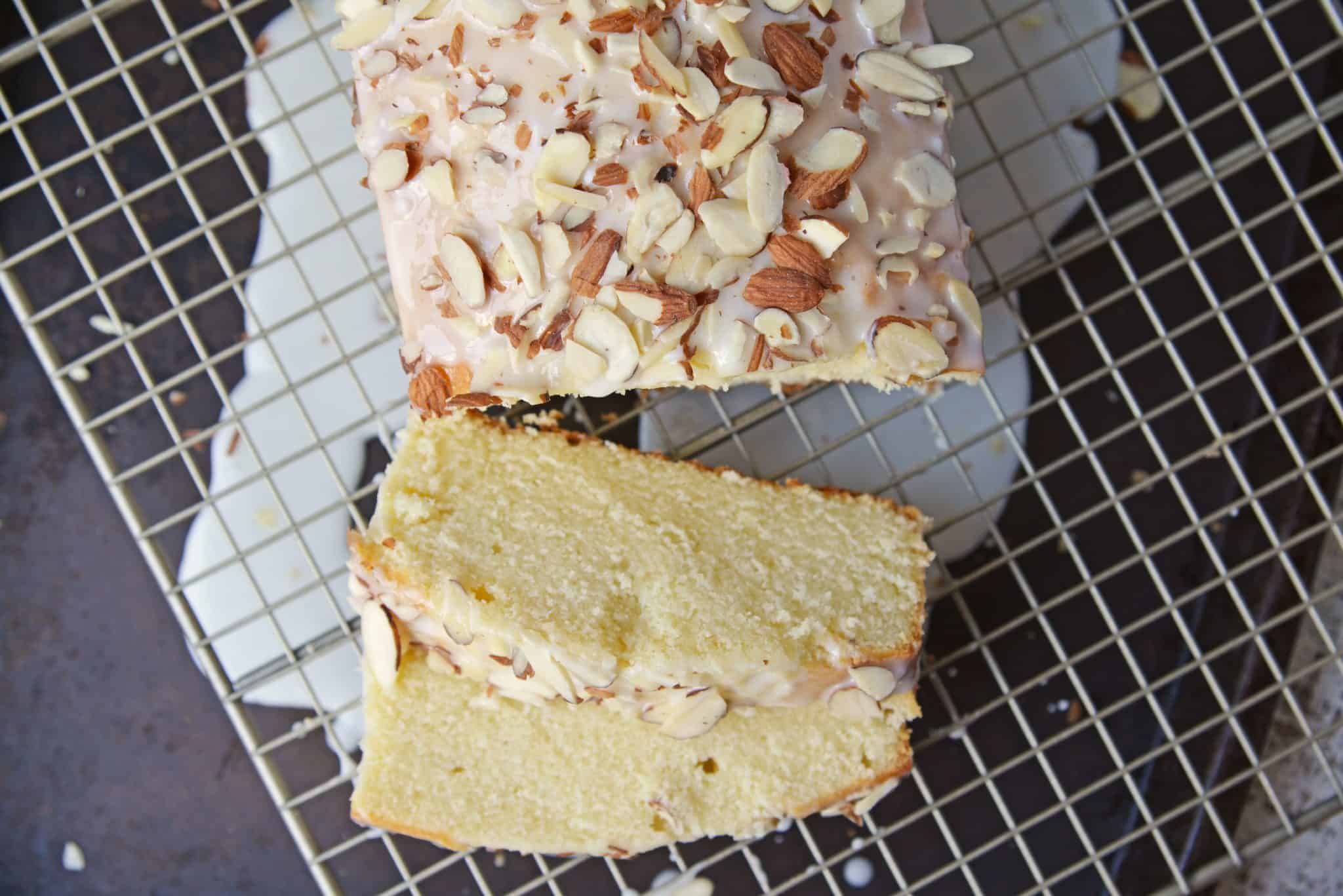 This Almond Pound Cake recipe is easy, moist and as dense as a pound cake should be. Topped with an almond pound cake glaze, it's the perfect dessert! #almondpoundcake #poundcakerecipe www.savoryexperiments.com