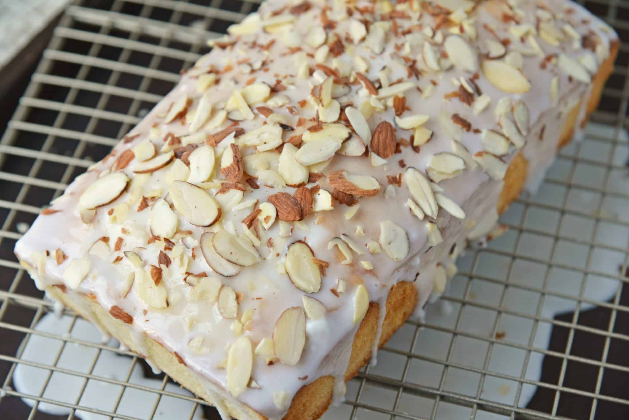 This Almond Pound Cake recipe is easy, moist and as dense as a pound cake should be. Topped with an almond pound cake glaze, it's the perfect dessert! #almondpoundcake #poundcakerecipe www.savoryexperiments.com