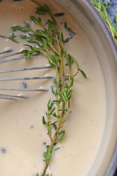 Au Poivre Peppercorn Sauce for steak can also be used for chicken or vegetables. An easy, creamy beef sauce spiked with peppercorns and Dijon mustard. #steaksauce #aupoivresauce #peppercornsauce www.savoryexperiments.com