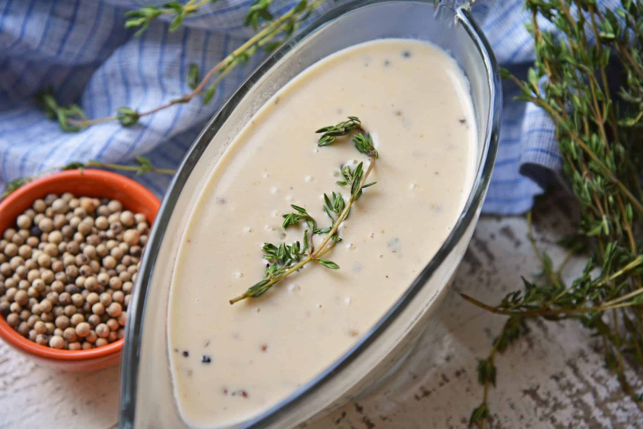 Au Poivre Peppercorn Sauce for steak can also be used for chicken or vegetables. An easy, creamy beef sauce spiked with peppercorns and Dijon mustard. #steaksauce #aupoivresauce #peppercornsauce www.savoryexperiments.com