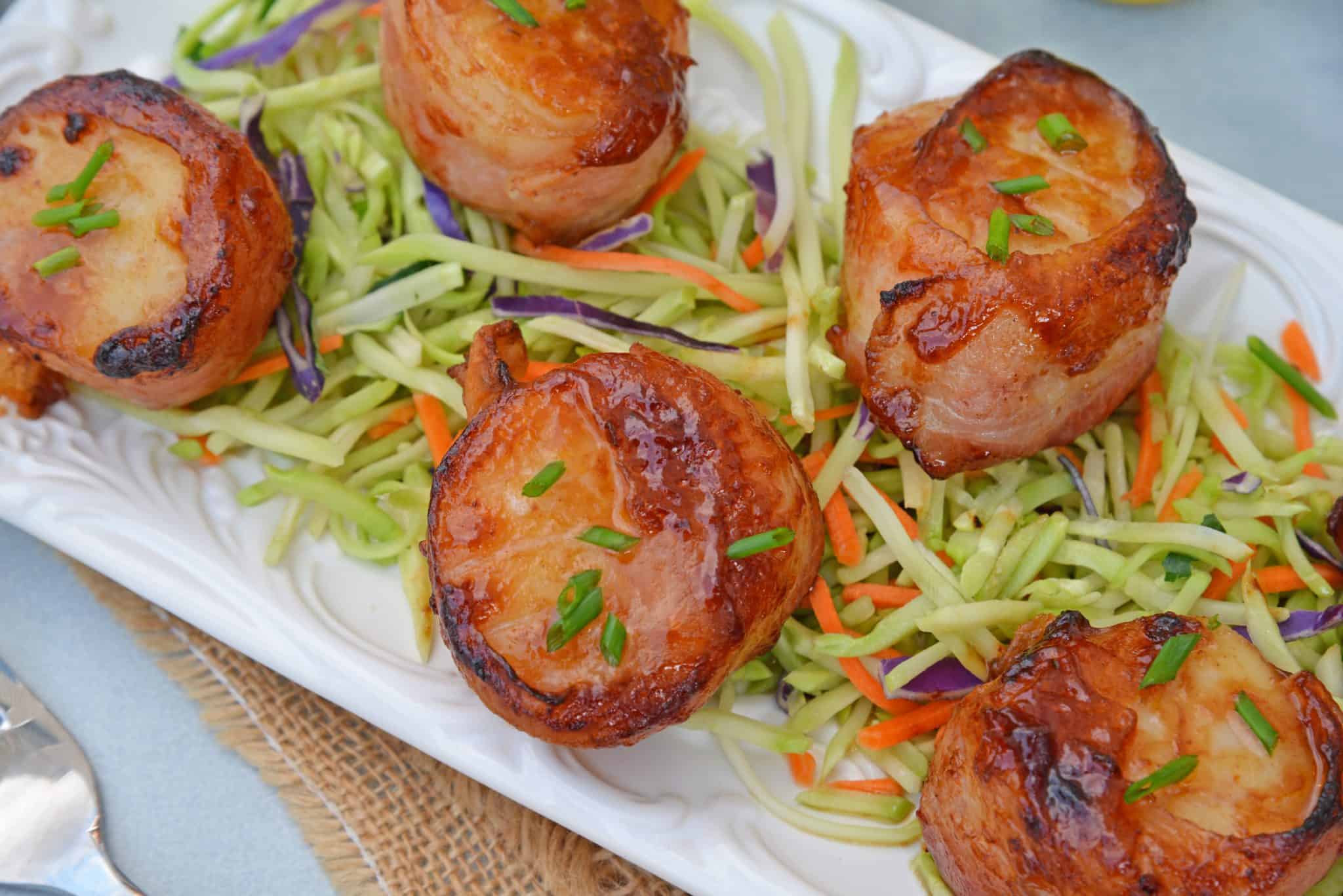 BBQ Bacon Wrapped Scallops are an easy and tasty seafood appetizer or dinner. With just a handful of ingredients, they're ready in just 15 minutes! #baconwrappedscallops #bakedscallops www.savoryexperiments.com