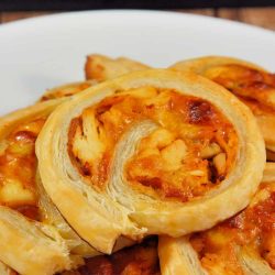 BBQ Chicken Pinwheels are a simple puff pastry appetizer, made with chicken, BBQ sauce, mayo and cheese. Easy, cheesy and deliciously flaky, it'll become one of your go-to pinwheel recipes. #puffpastryrecipes #appetizerrecipes #pinwheels www.savoryexperiments.com