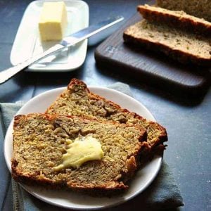 Two slices of banana oat bread with butter