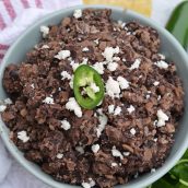 These homemade refried black beans are simple and easy to make and so versatile! Serve as a dip, on tacos, burritos or nachos or as a side to any dish! #homemaderefriedbeans #howtomakerefriedbeans #refriedblackbeans www.savoryexperiments.com