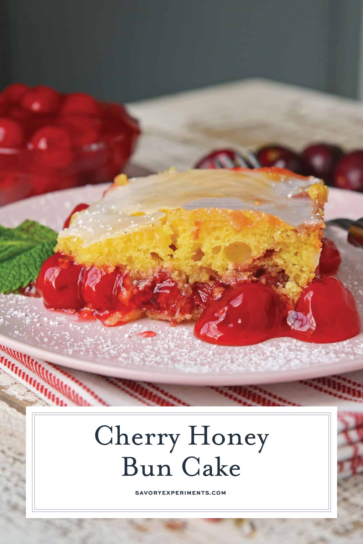 What is better than a Honey Bun Cake? A CHERRY Honey Bun Cake! Yellow cake mix laced with cinnamon, brown sugar and cherry pie filling, drizzled with almond glaze. #honeybuncake www.savoryexperiments.com