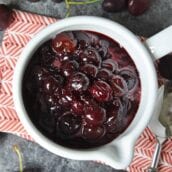 This Fresh Cherry Sauce is a yummy way to use fresh cherries. Spoon over ice cream, cake, waffles and more! #cherrysaucerecipe #freshcherryrecipes #desserttoppings www.savoryexperiments.com