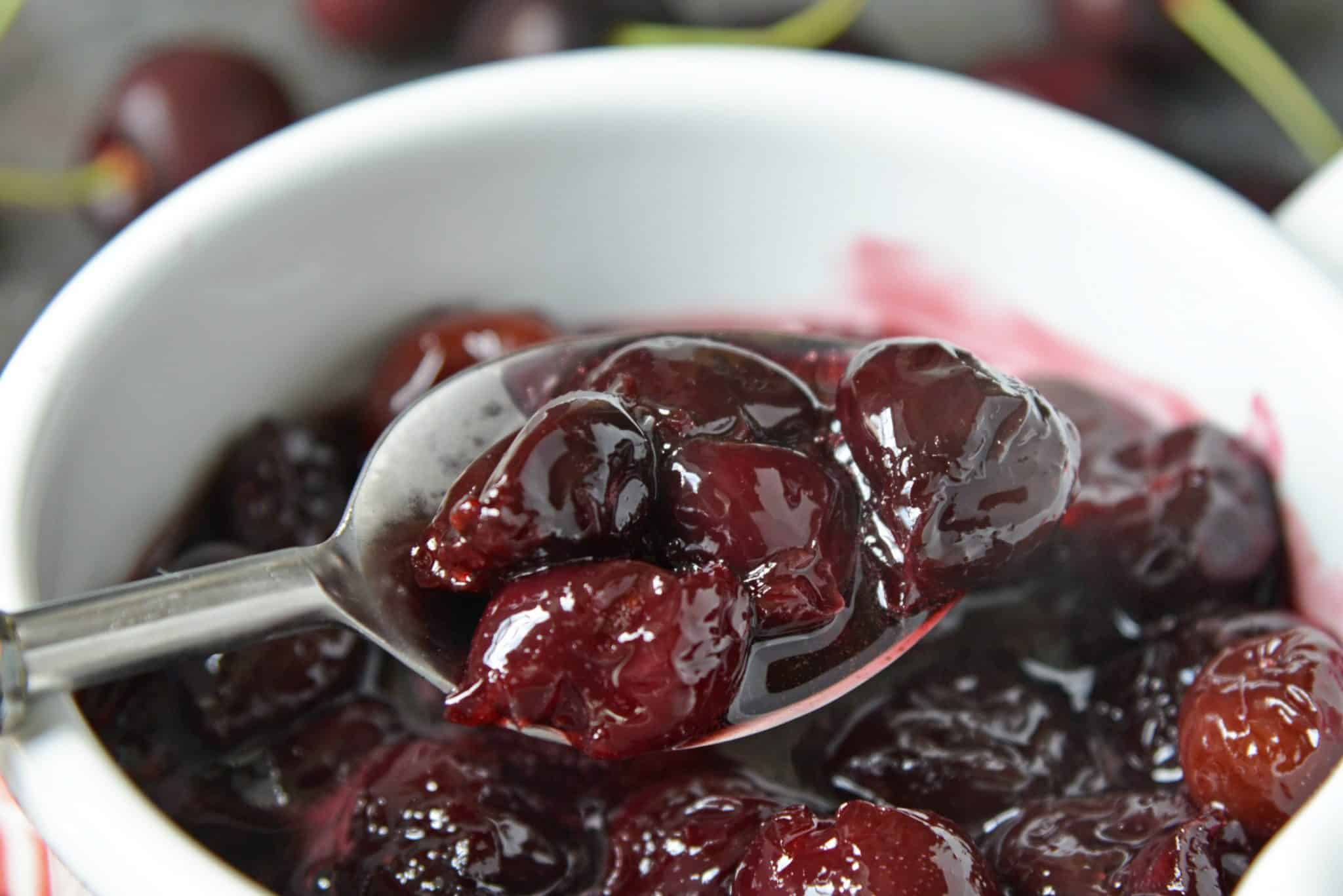 This Fresh Cherry Sauce is a yummy way to use fresh cherries. Spoon over ice cream, cake, waffles and more! #cherrysaucerecipe #freshcherryrecipes #desserttoppings www.savoryexperiments.com