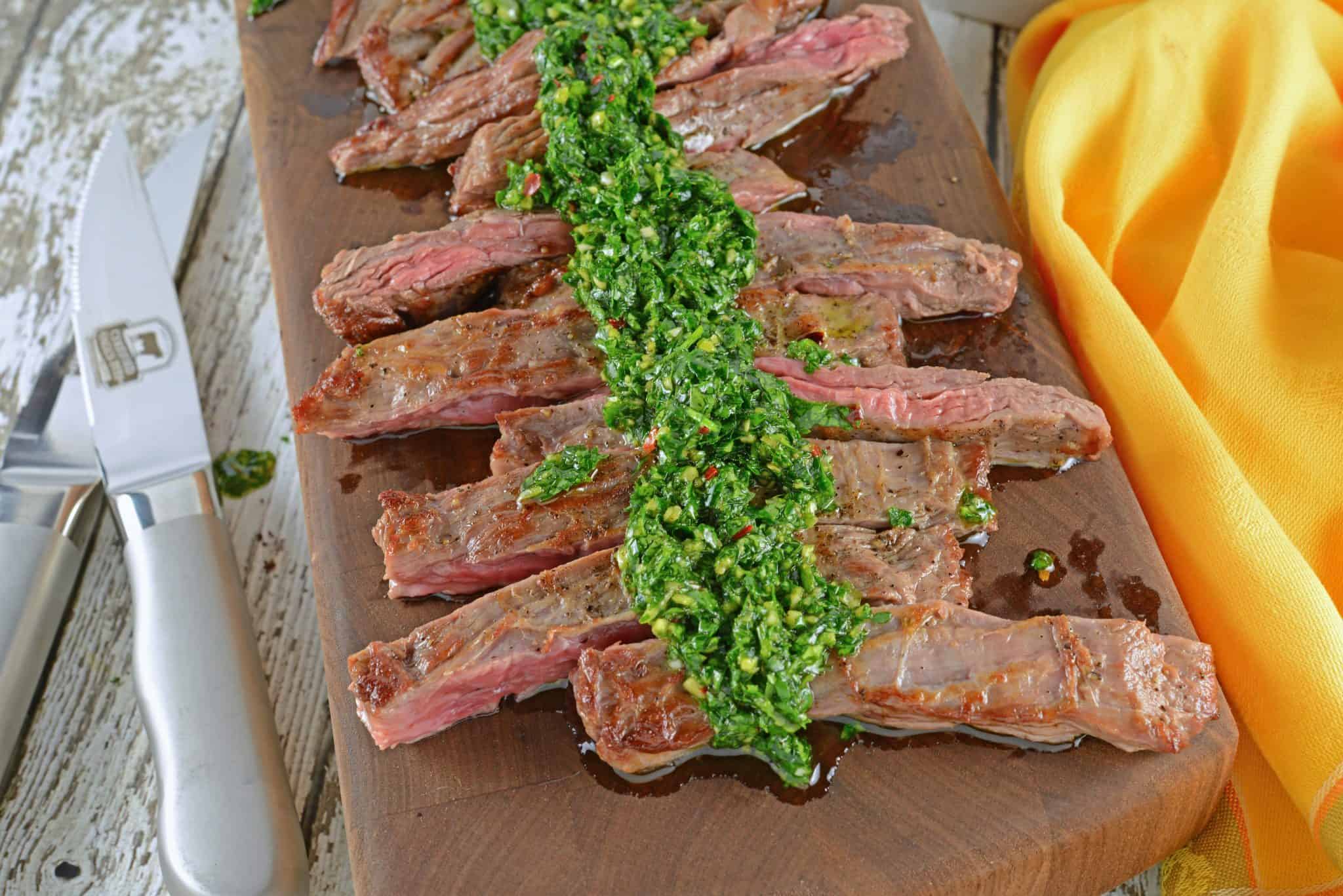 Skirt Steak Chimichurri is a grilled steak recipe that'll leave you drooling! Easy to make and topped with a delicious chimichurri sauce. #whatisskirtsteak #whatischimichurri #grilledsteakrecipe www.savoryexperiments.com