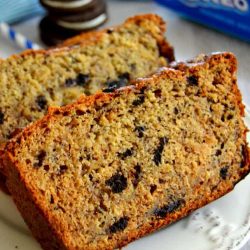 Two slices of cookies and cream banana bread on a white plate