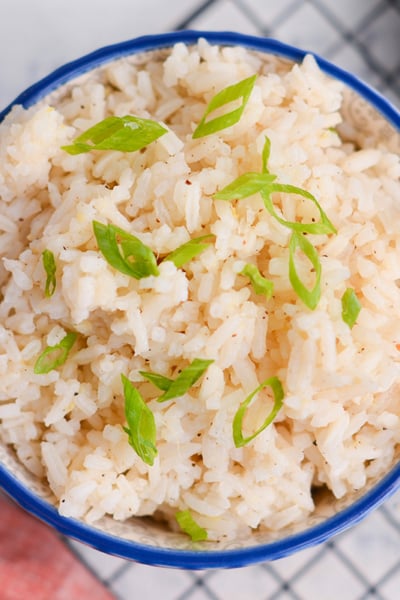 overhead bowl of ginger rice with scallions