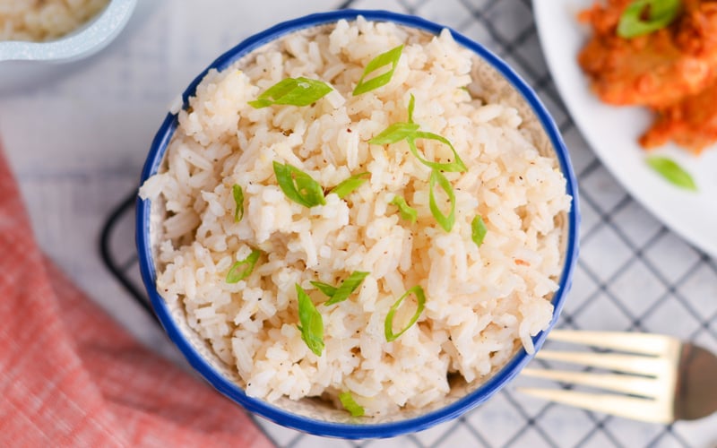 overhead bowl of ginger rice with scallions