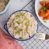 overhead of ginger rice next to orange chicken