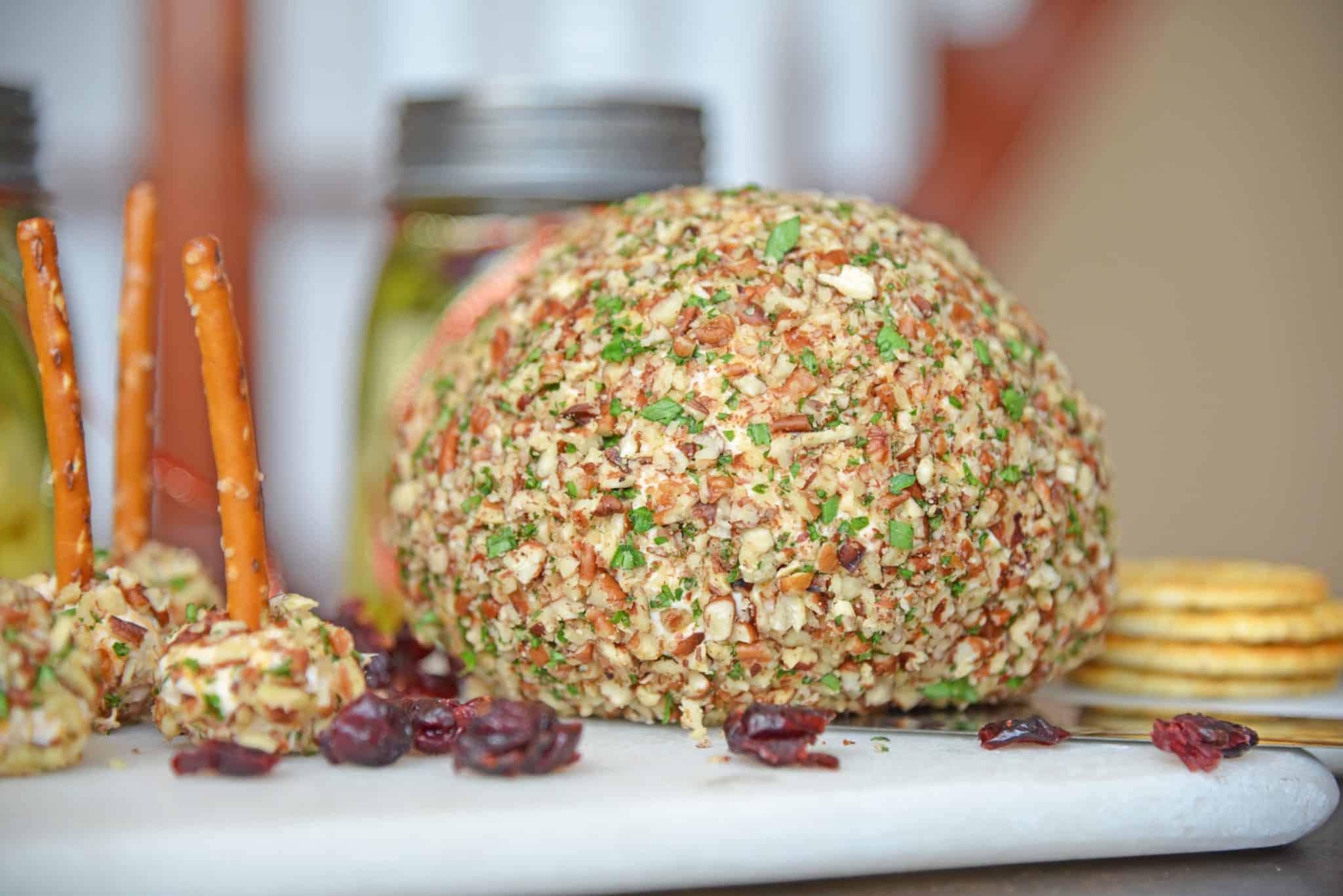 This cheese ball with cream cheese is a classic Party Cheese Ball recipe, made with simple ingredients. A must-make for any and all parties! #partycheeseballrecipe #creamcheeseball www.savoryexperiments.com